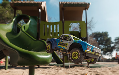 Action Shot showcasing the Bash-Anywhere Small Scale Size of the ARRMA GROM RC Truck and Buggy Family